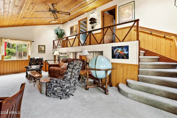 a kitchen with stainless steel appliances kitchen island granite countertop a table and chairs in it