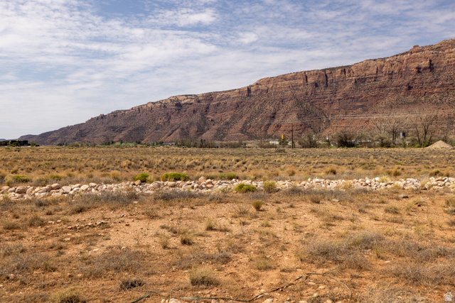 212 Lidia Circle, Unit 17 Moab, UT 84532 - Photo 18 of 24 Expansive desert landscape featuring a prominent red rock mountain backdrop