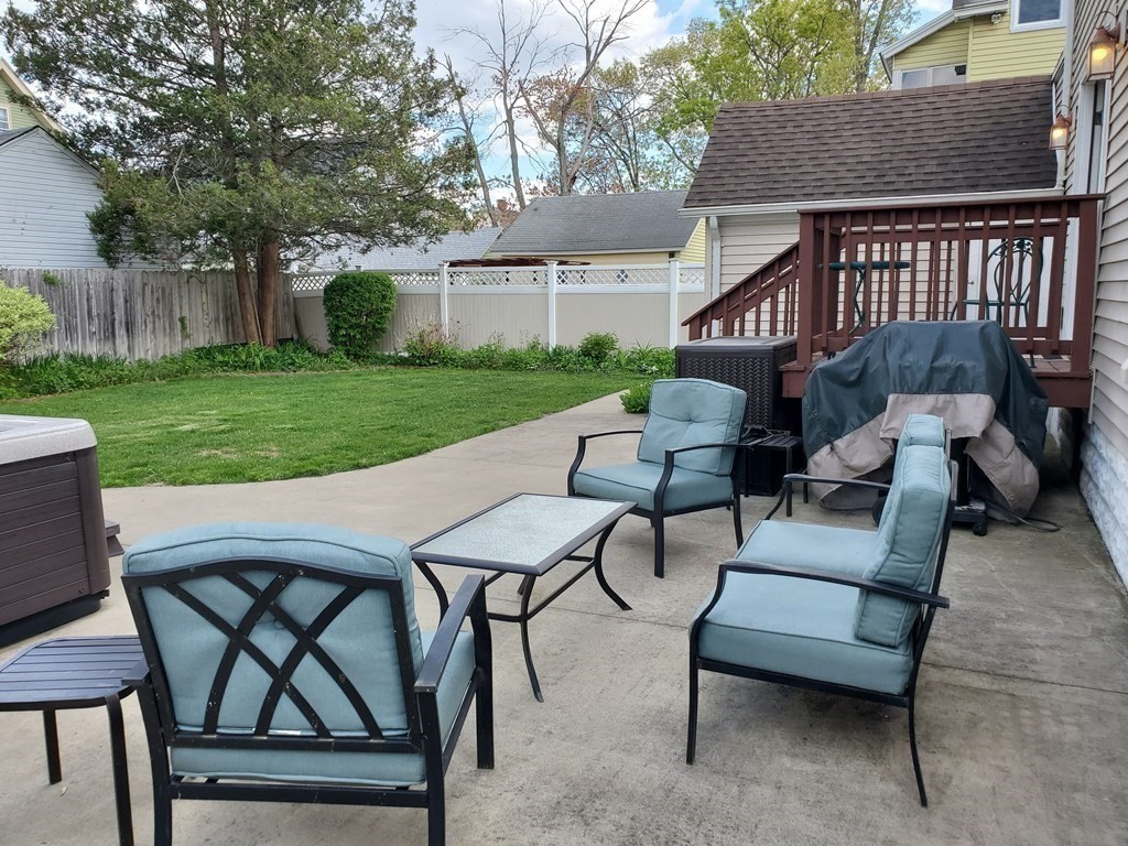 61 Windemere Street Springfield, MA 01104 - Photo 11 of 42 a view of a patio with a table and chairs