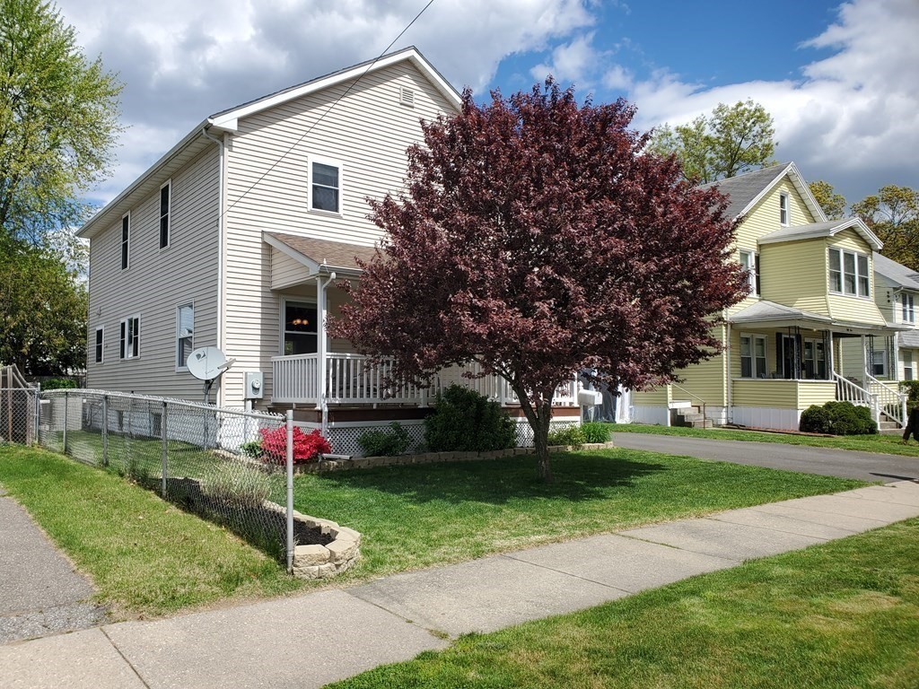 61 Windemere Street Springfield, MA 01104 - Photo 2 of 42 a front view of a house with a yard and trees