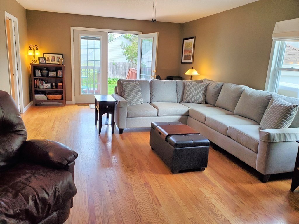 61 Windemere Street Springfield, MA 01104 - Photo 25 of 42 a living room with furniture and a wooden floor