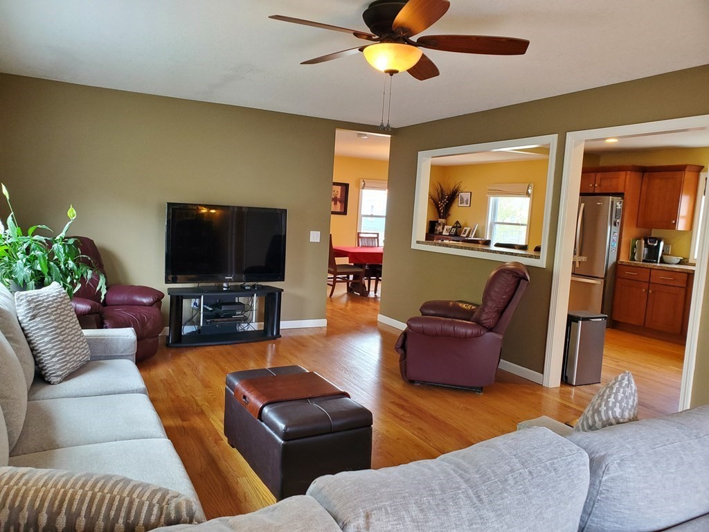 61 Windemere Street Springfield, MA 01104 - Photo 27 of 42 a living room with furniture and a flat screen tv