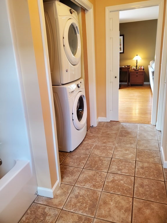 61 Windemere Street Springfield, MA 01104 - Photo 30 of 42 a view of a storage & utility room with washer and dryer