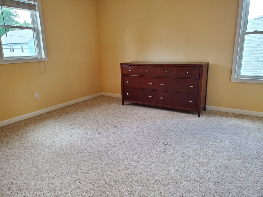 61 Windemere Street Springfield, MA 01104 - Photo 34 of 42 an empty room with windows and cabinet