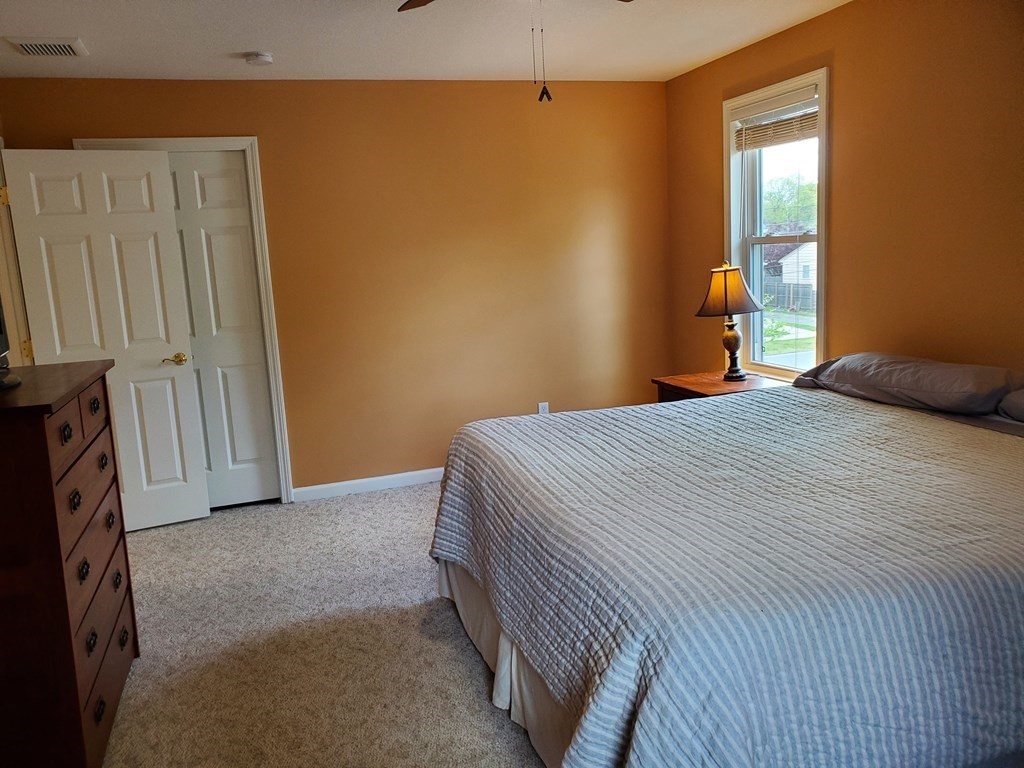 61 Windemere Street Springfield, MA 01104 - Photo 35 of 42 a bedroom with a bed and a window