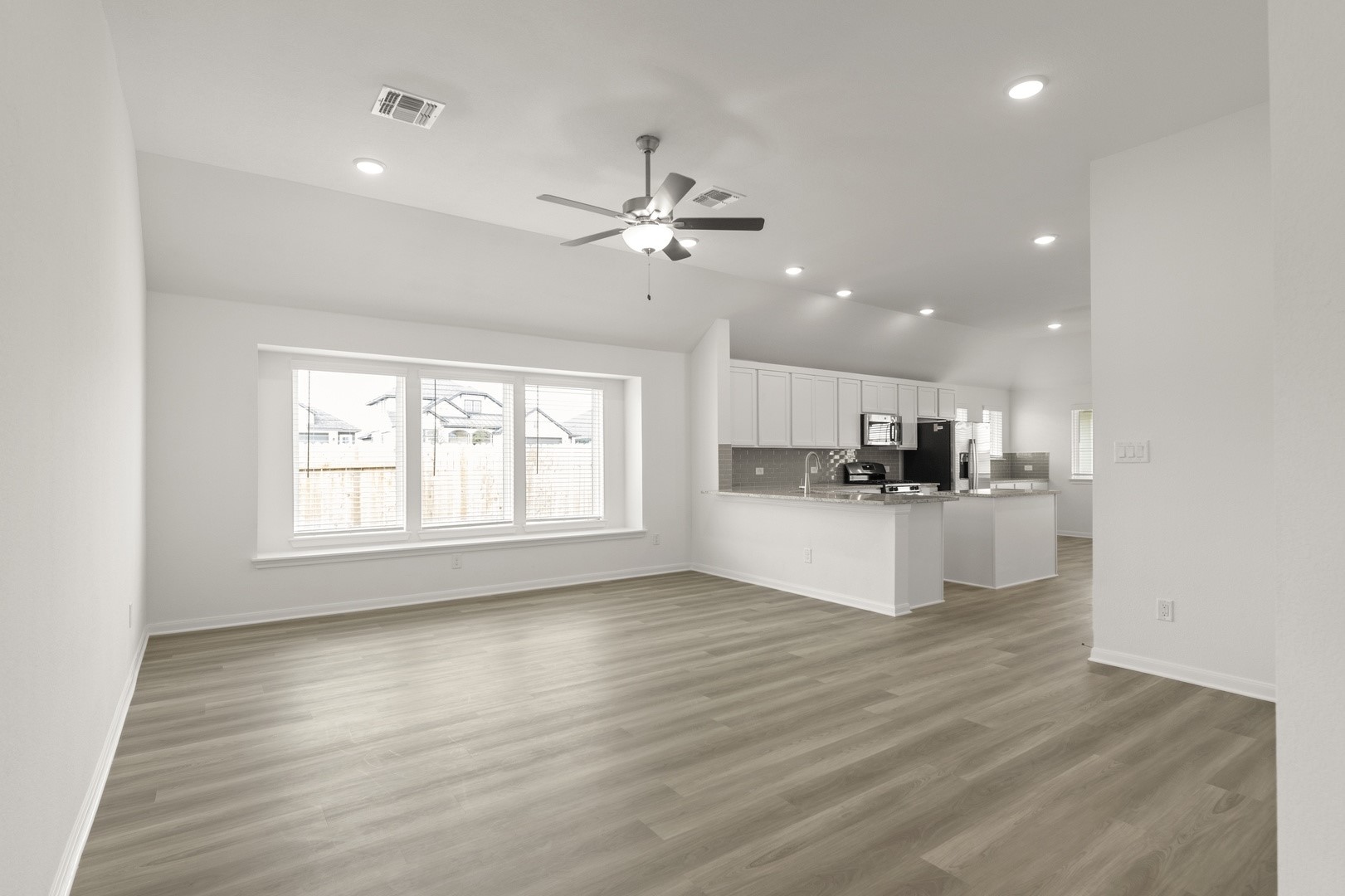 3729 Pin Oak Hills Seguin, TX 78155 - Photo 9 of 22 Unfurnished living room featuring light wood finished floors, ceiling fan, and recessed lighting