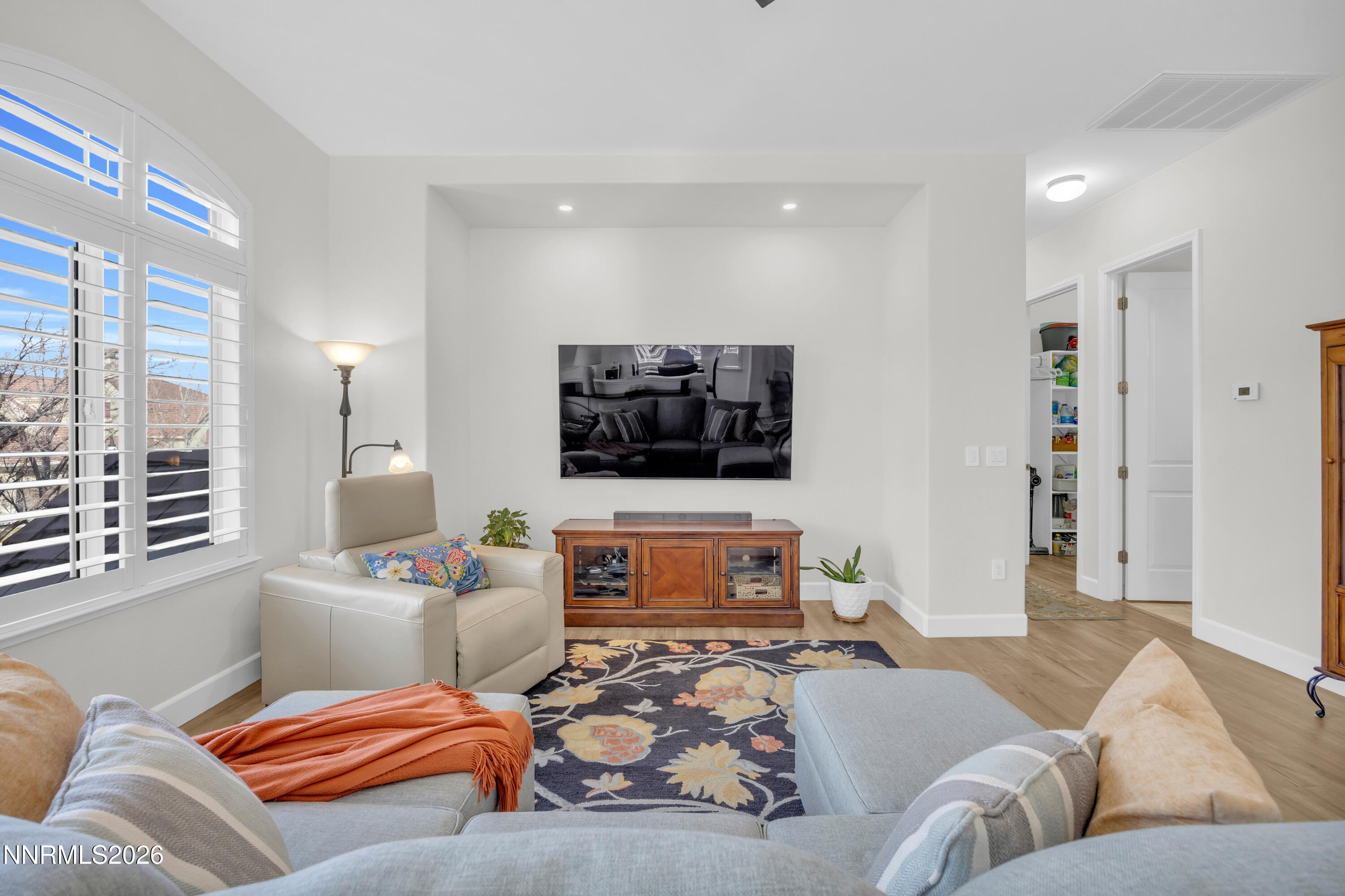 9900 Wilbur May Parkway, Unit 3903 Reno, NV 89521 - Photo 11 of 37 a living room with furniture and a flat screen tv