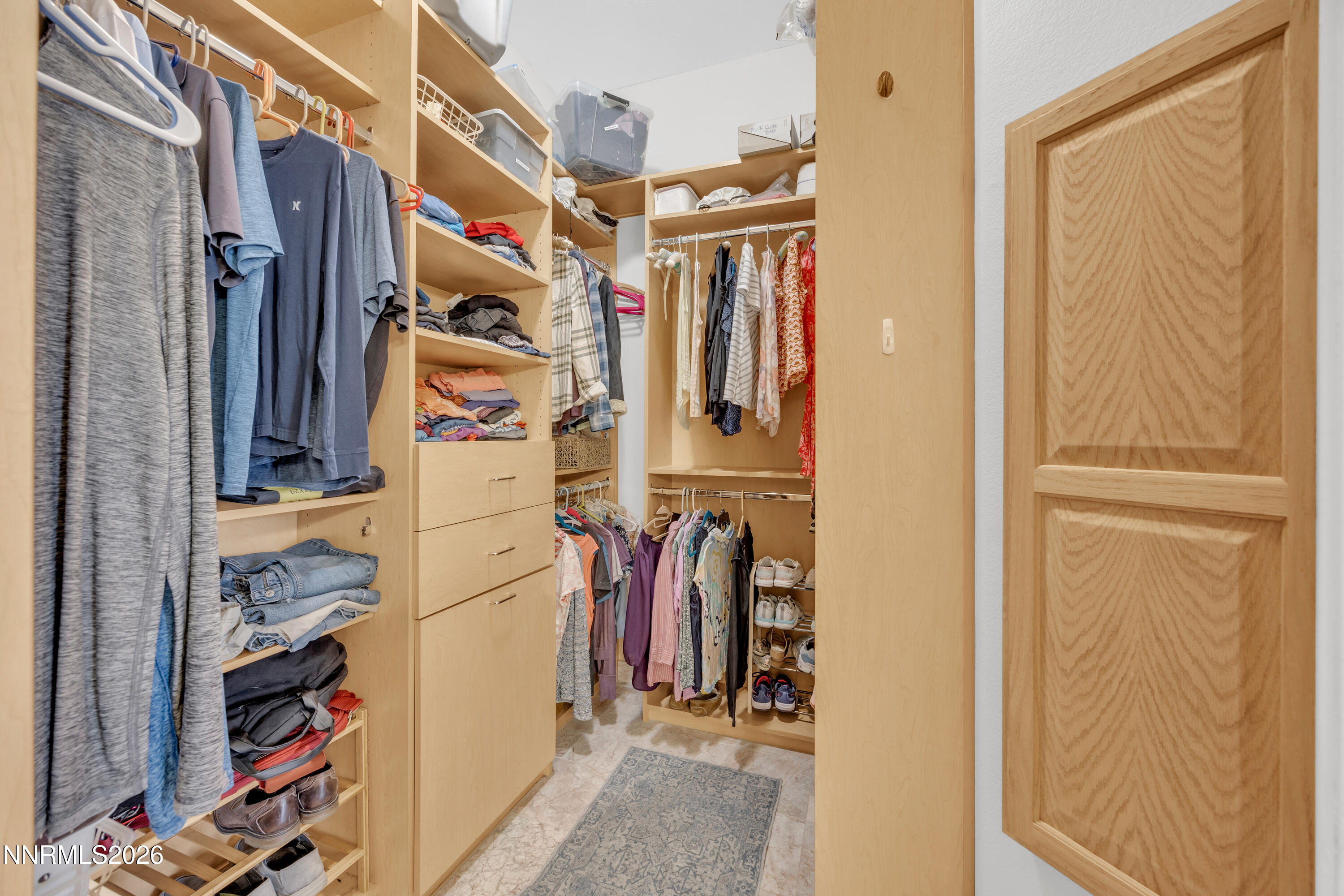 9900 Wilbur May Parkway, Unit 3903 Reno, NV 89521 - Photo 18 of 37 a view of walk in closet with clothes and shoes