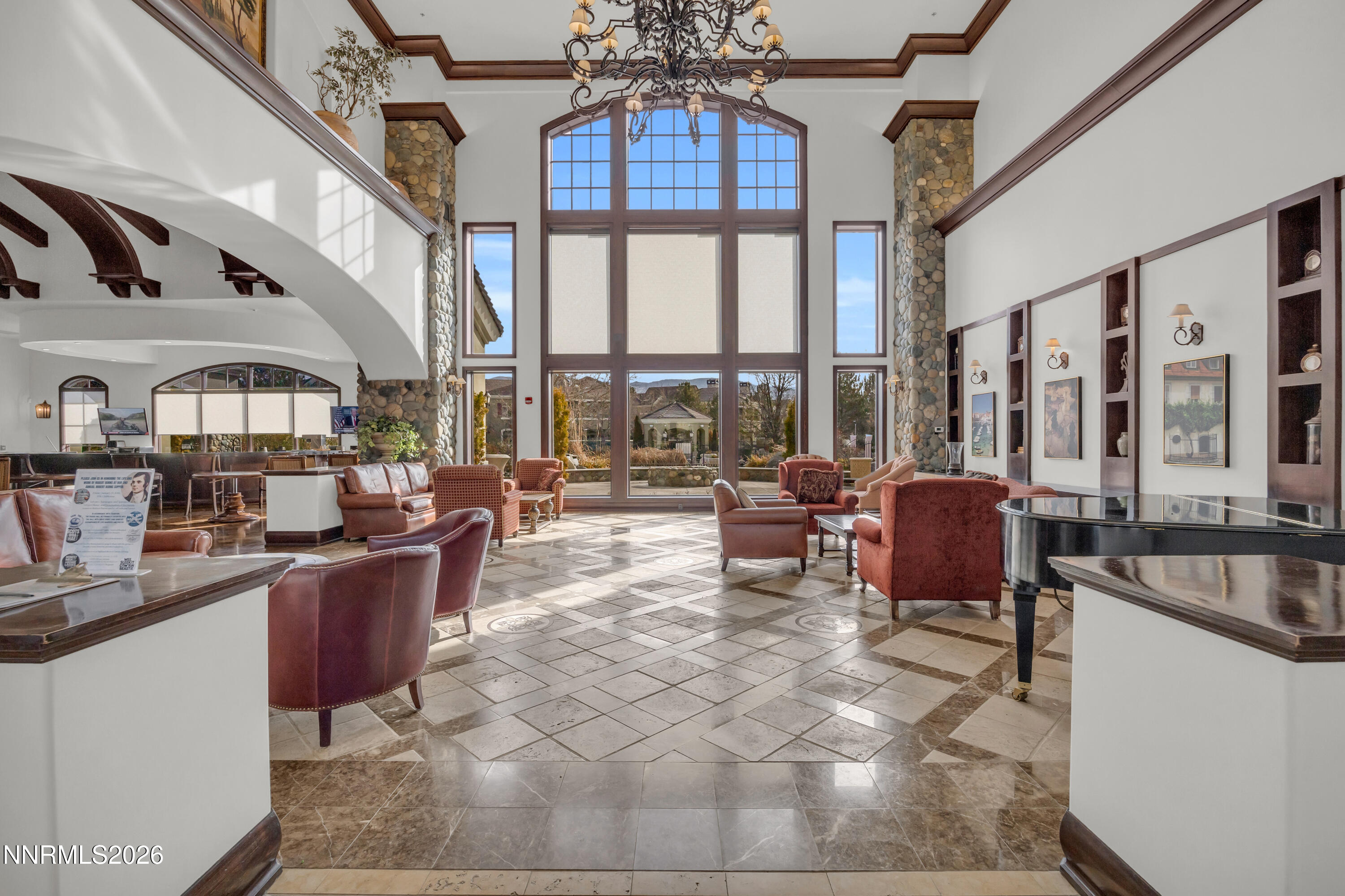9900 Wilbur May Parkway, Unit 3903 Reno, NV 89521 - Photo 26 of 37 a living room with furniture a rug appliances and a large window