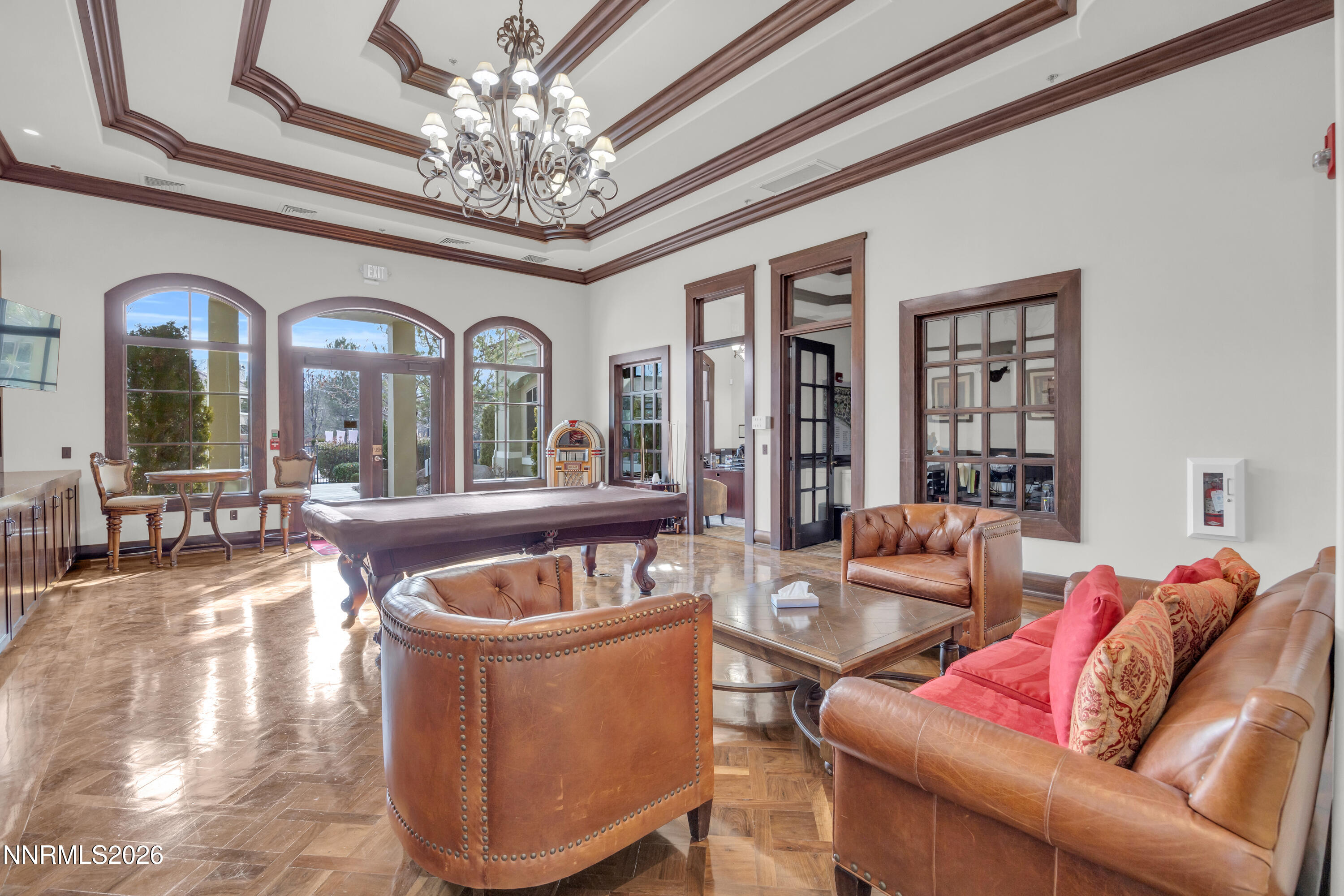 9900 Wilbur May Parkway, Unit 3903 Reno, NV 89521 - Photo 27 of 37 a living room with furniture a chandelier and a large window