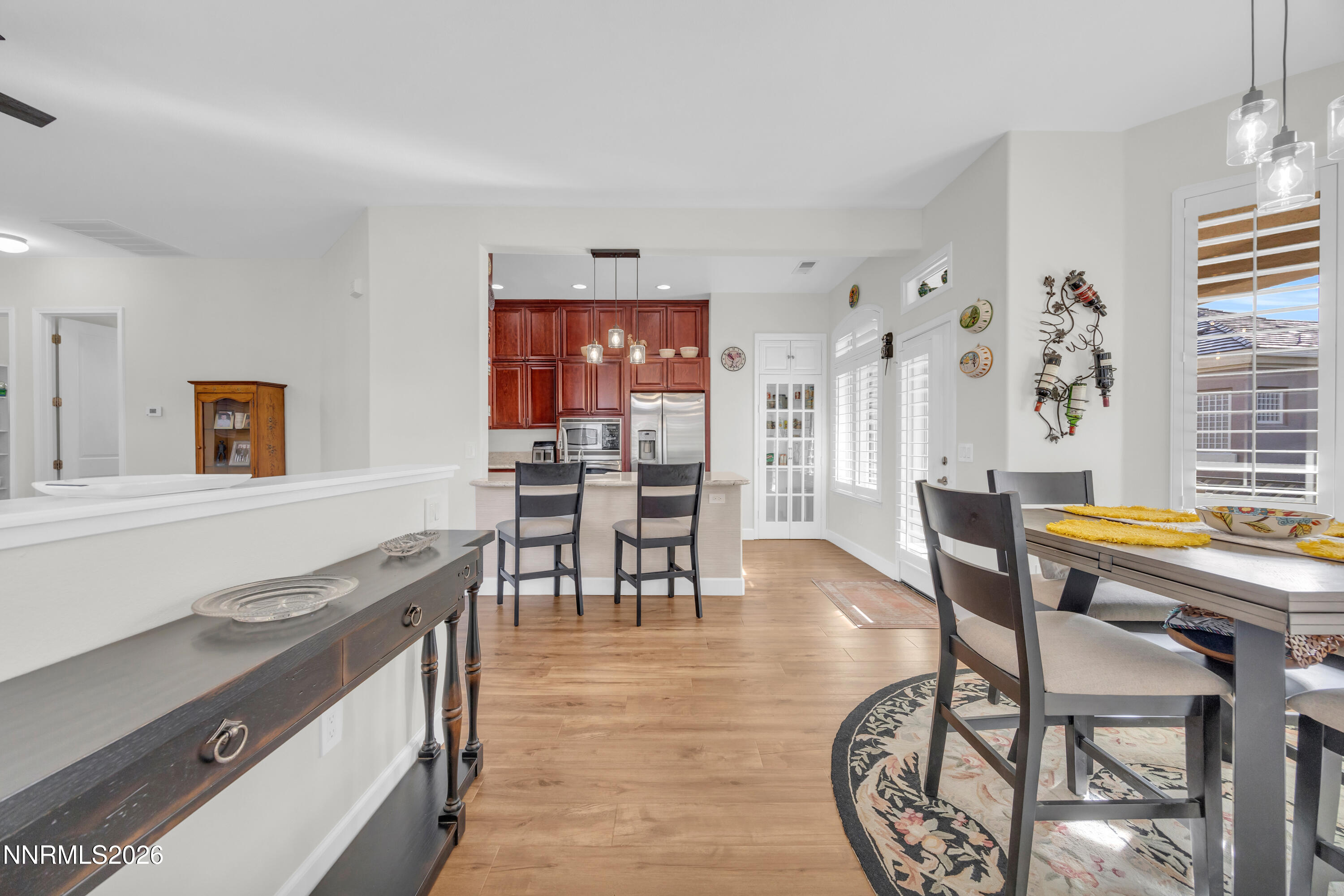 9900 Wilbur May Parkway, Unit 3903 Reno, NV 89521 - Photo 3 of 37 a living room with furniture a dining table and a stove top oven