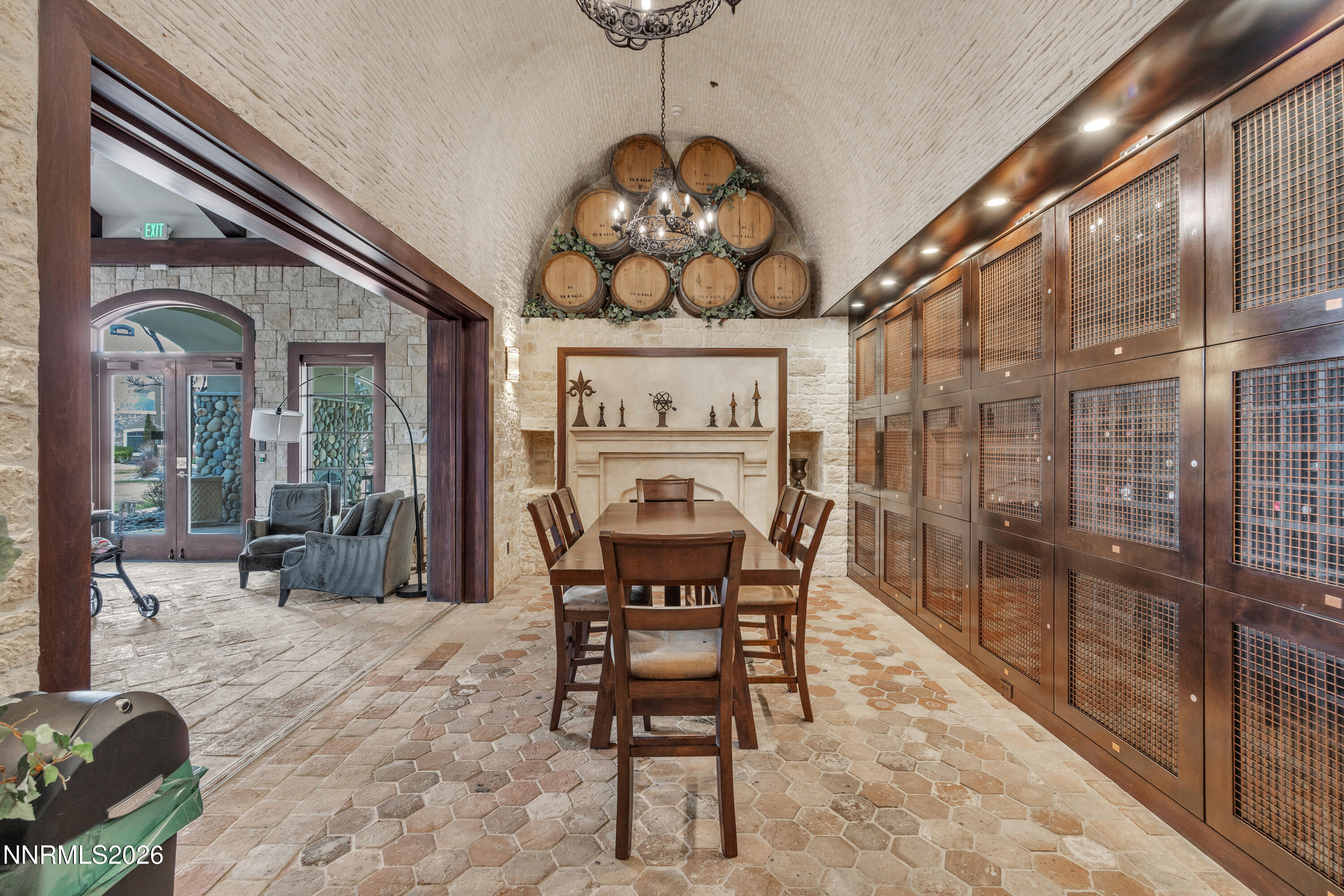 9900 Wilbur May Parkway, Unit 3903 Reno, NV 89521 - Photo 32 of 37 a dining room with furniture a chandelier and wooden floor