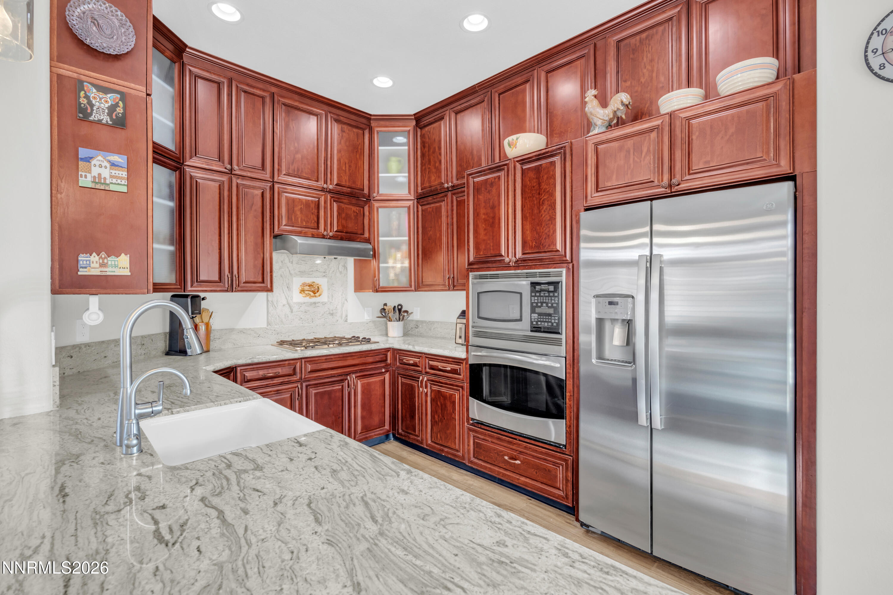 9900 Wilbur May Parkway, Unit 3903 Reno, NV 89521 - Photo 9 of 37 a kitchen with granite countertop a sink stainless steel appliances and cabinets