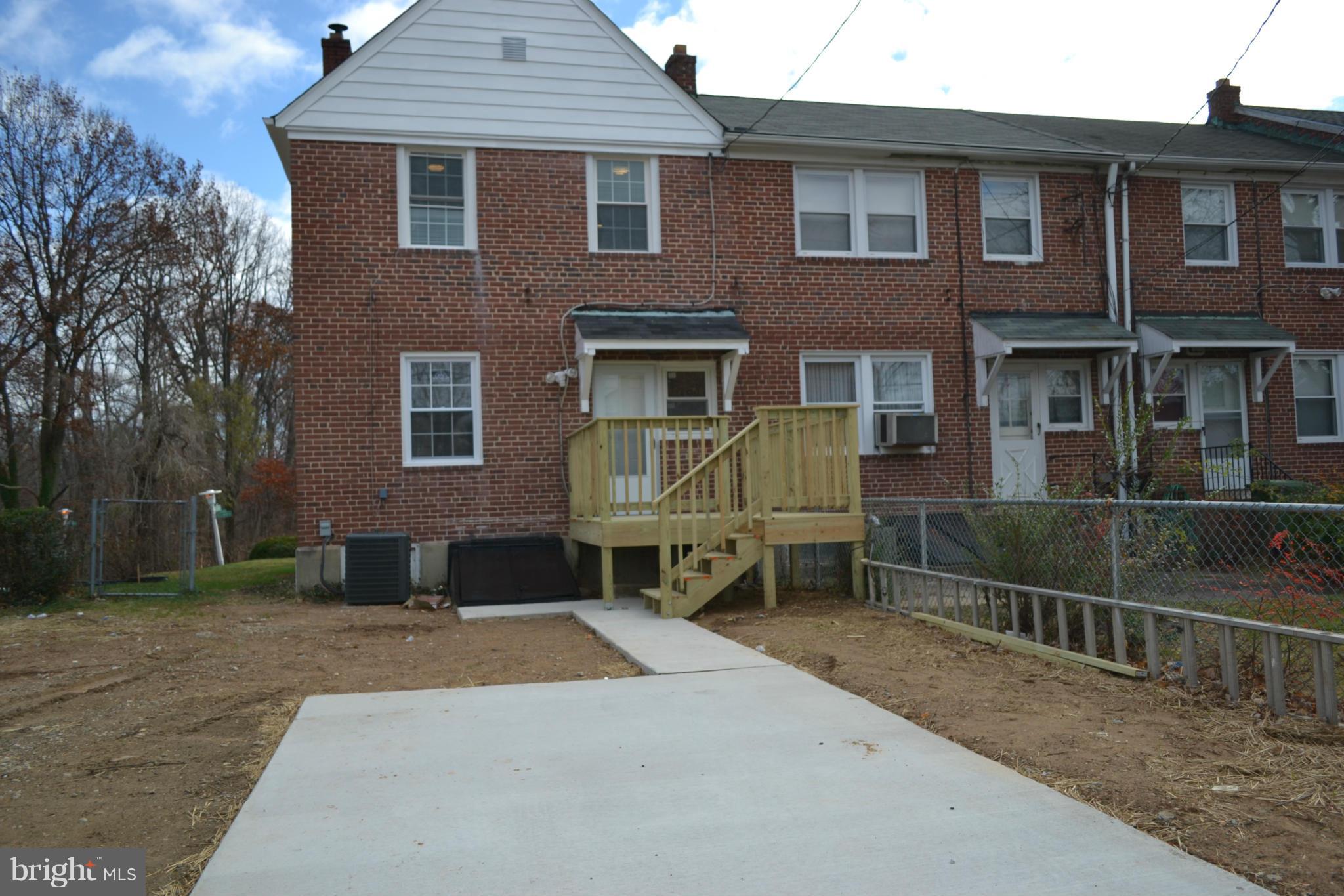 5216 Kelway Road Baltimore, MD 21239 - Photo 14 of 28 a front view of a house with yard