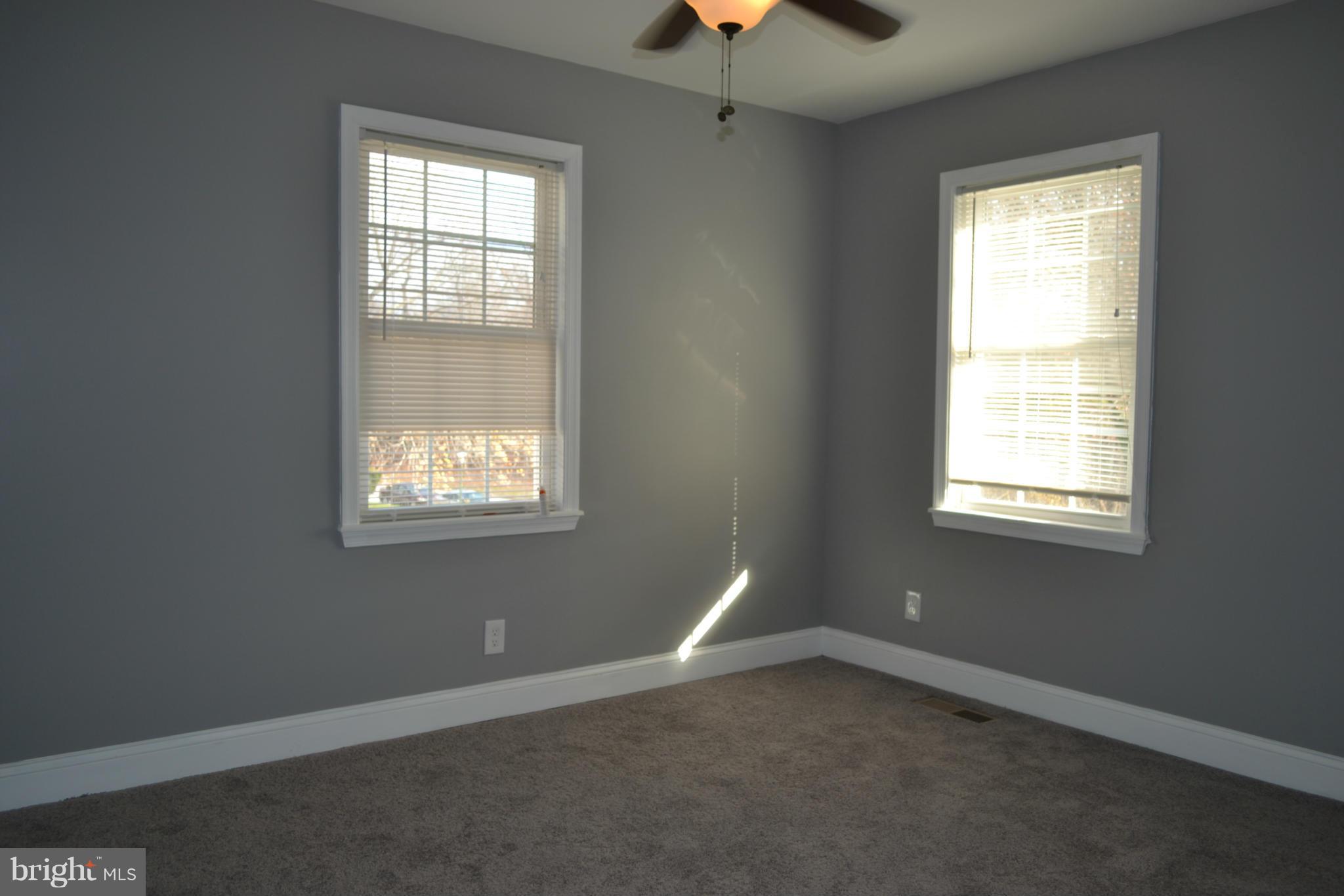 5216 Kelway Road Baltimore, MD 21239 - Photo 22 of 28 an empty room with a window