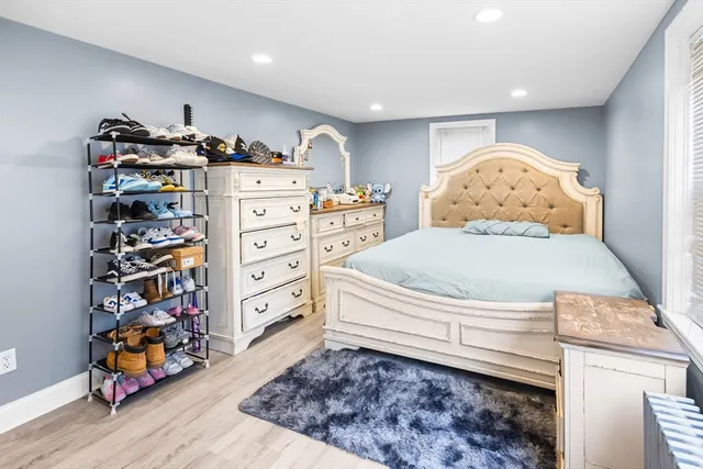 a view of a room with furniture and a window