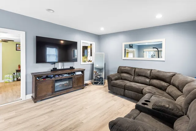 a kitchen with stainless steel appliances granite countertop a refrigerator a stove and a sink