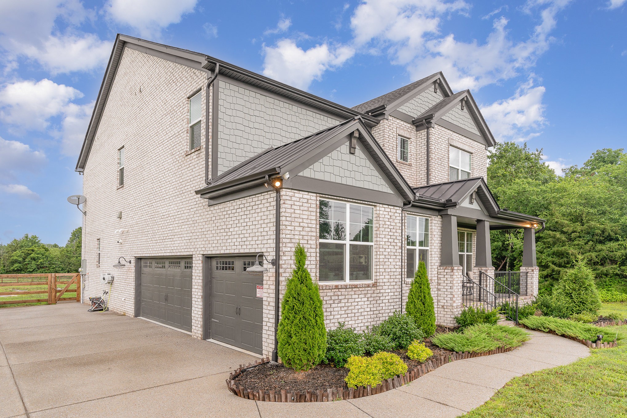 515 Vesta Road Lebanon, TN 37090 - Photo 2 of 31 a front view of a house with a yard and potted plants