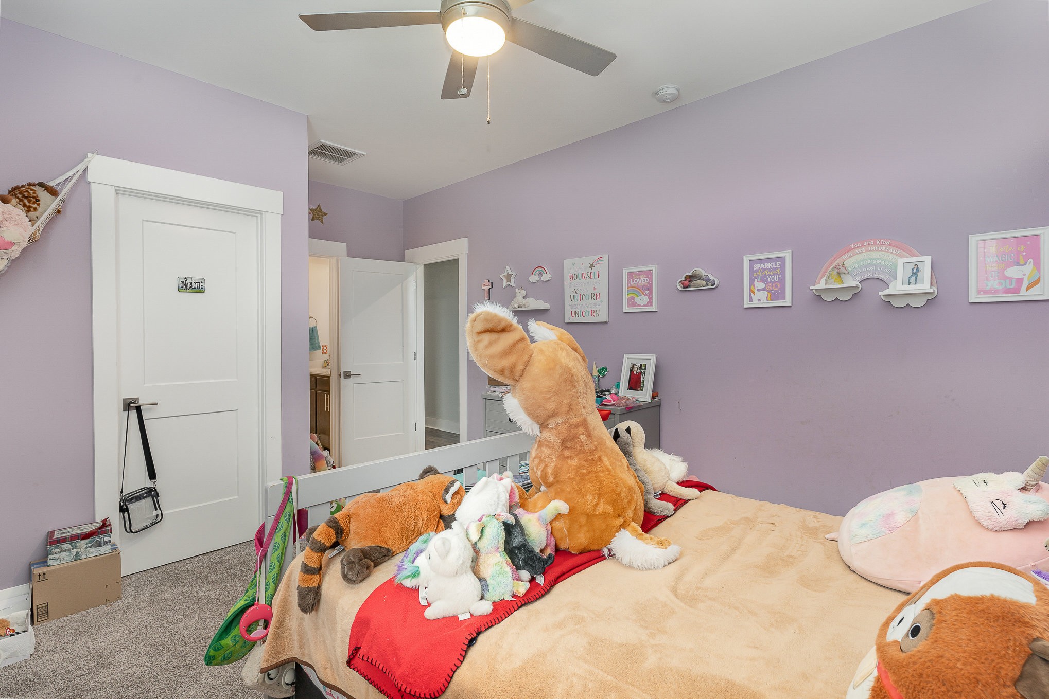 515 Vesta Road Lebanon, TN 37090 - Photo 21 of 31 a bedroom with a bed and a chandelier