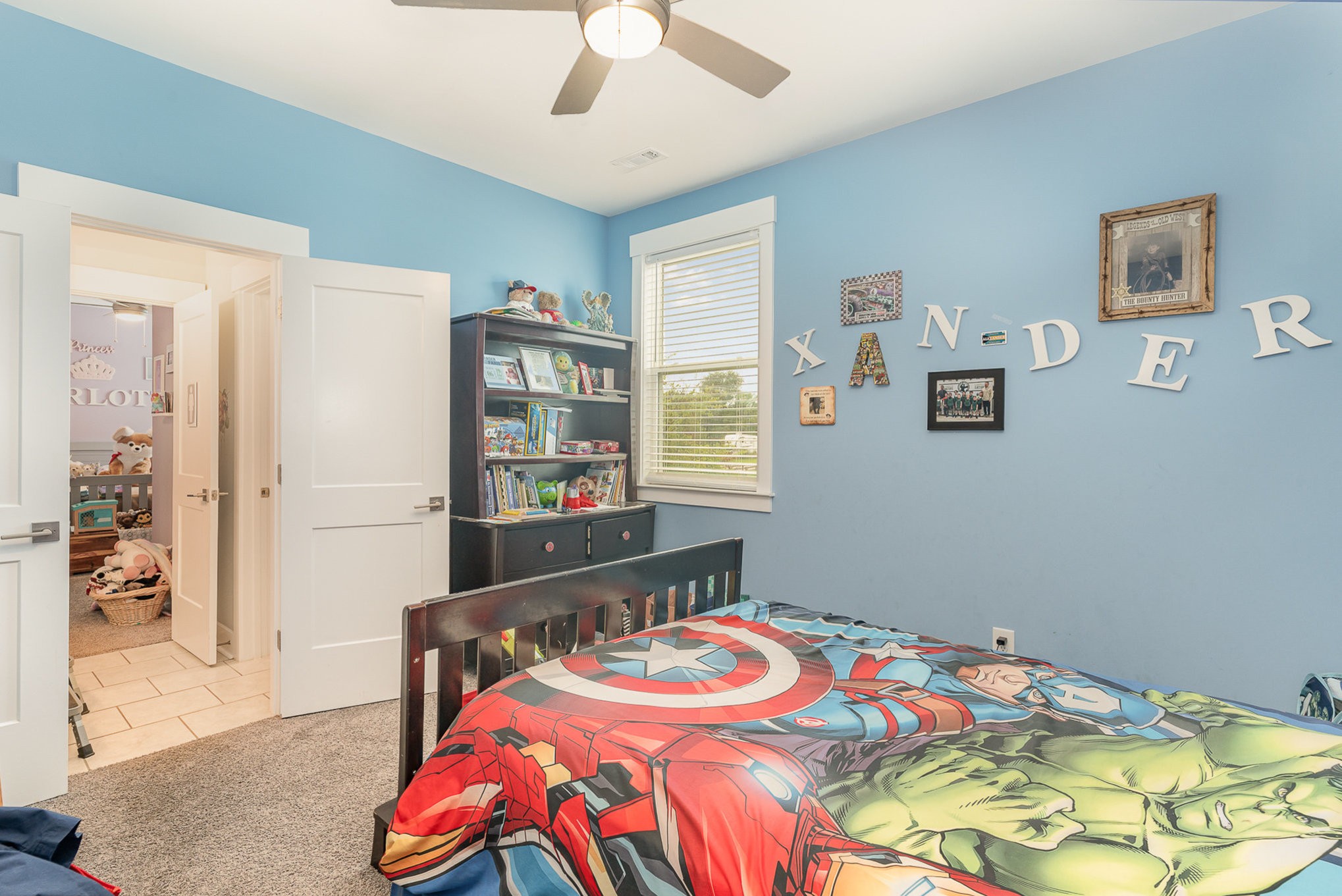 515 Vesta Road Lebanon, TN 37090 - Photo 25 of 31 a bedroom with a bed and a chandelier