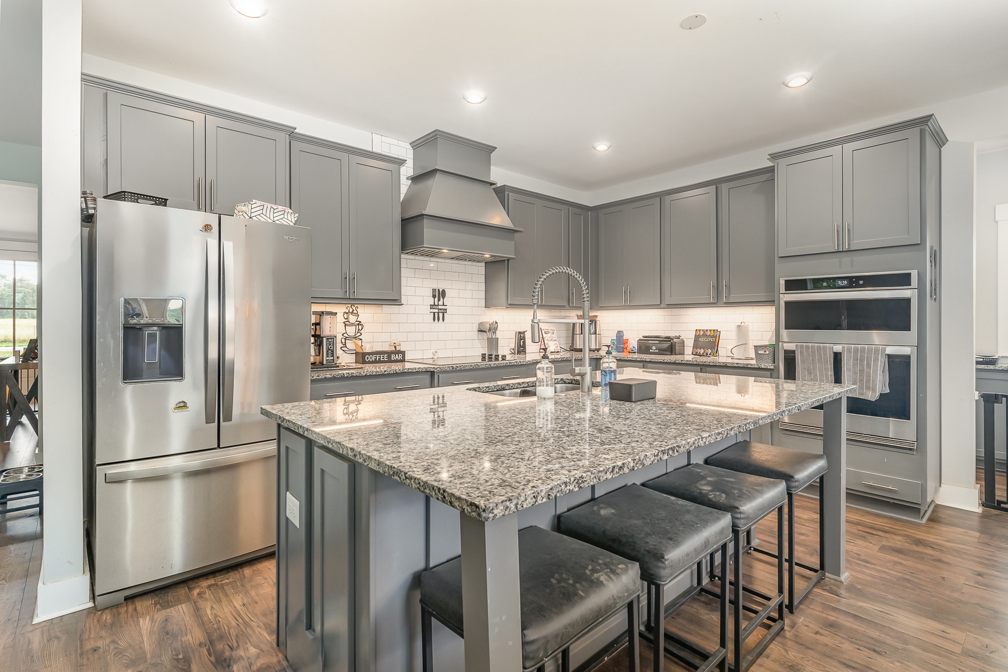515 Vesta Road Lebanon, TN 37090 - Photo 8 of 31 a kitchen with refrigerator a sink and chairs
