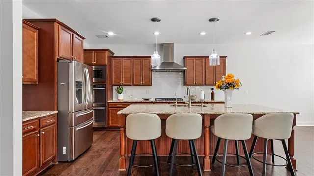 an empty room with windows and wooden door
