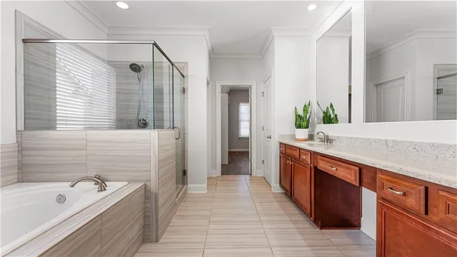 a sink with a granite countertop white and a mirror