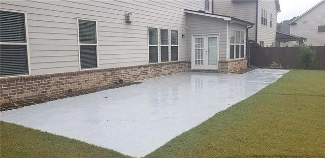 an aerial view of a house with a swimming pool