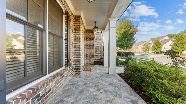 a view of hallway with wooden floor