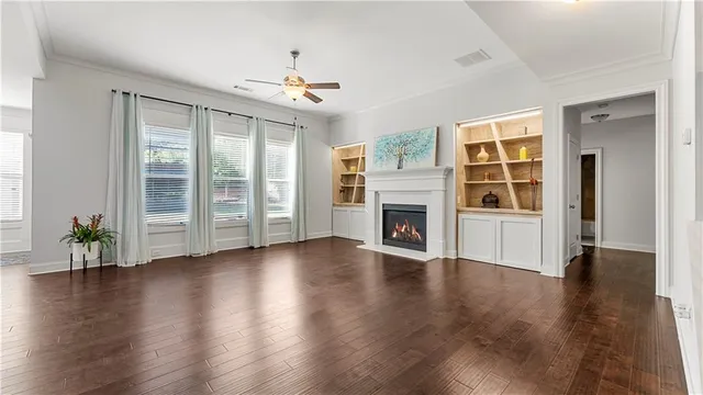 a view of a dining room with furniture and a chandelier
