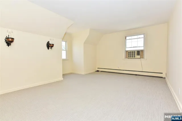 a view of a room that has a window in it