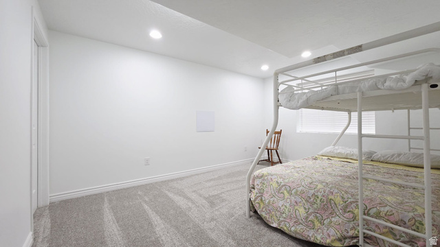 1437 925 South Vernal, UT 84078 - Photo 29 of 47 Carpeted room featuring recessed lighting, white walls, and a window with horizontal blinds