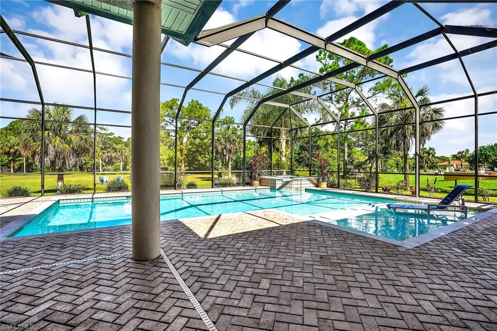281 19th Street Southwest Naples, FL 34117 - Photo 27 of 35 Pool area with shallow area for sunning