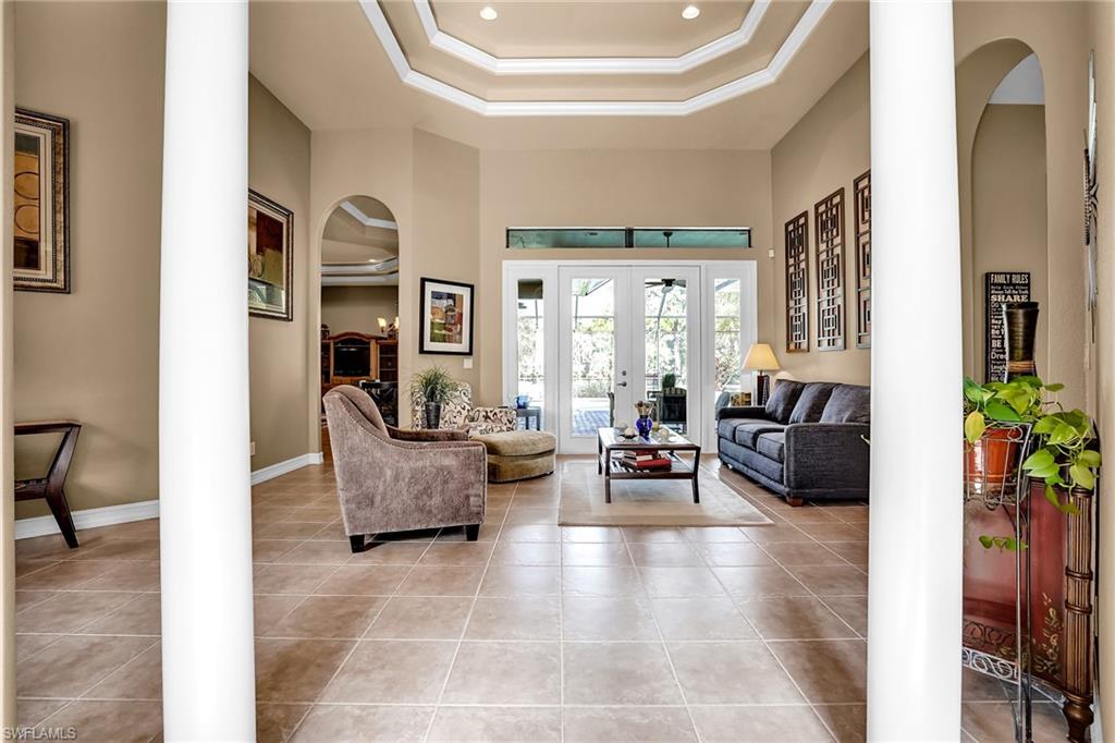 281 19th Street Southwest Naples, FL 34117 - Photo 3 of 35 Living room from entry foyer