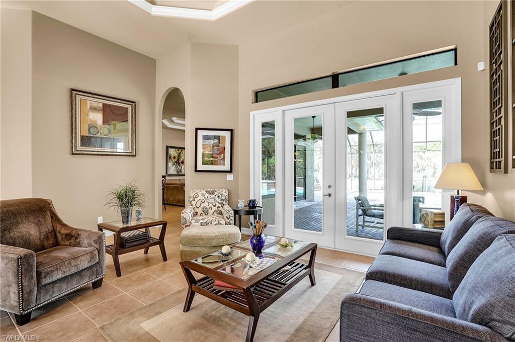 281 19th Street Southwest Naples, FL 34117 - Photo 6 of 35 Living room with family room through the arched opening
