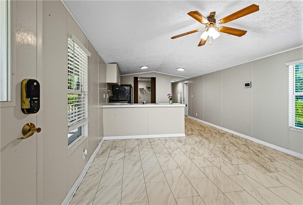 221 McAllister Road Cornelia, GA 30531 - Photo 12 of 58 a view of a kitchen with a sink and a window