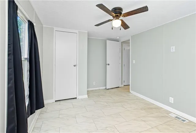 a kitchen with stainless steel appliances granite countertop a refrigerator sink and stove