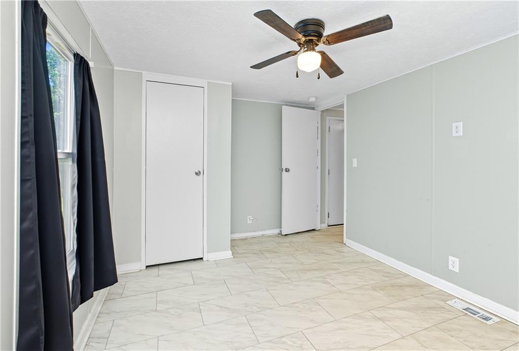 221 McAllister Road Cornelia, GA 30531 - Photo 16 of 58 a view of a chandelier fan in a room