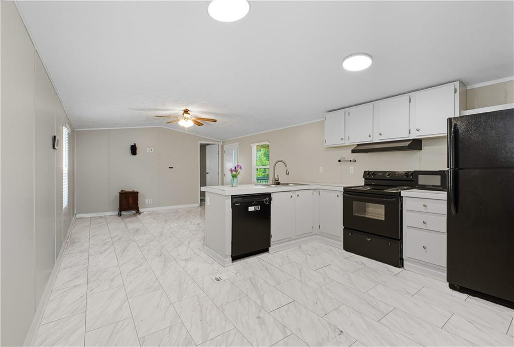 221 McAllister Road Cornelia, GA 30531 - Photo 17 of 58 a kitchen with a refrigerator and a stove