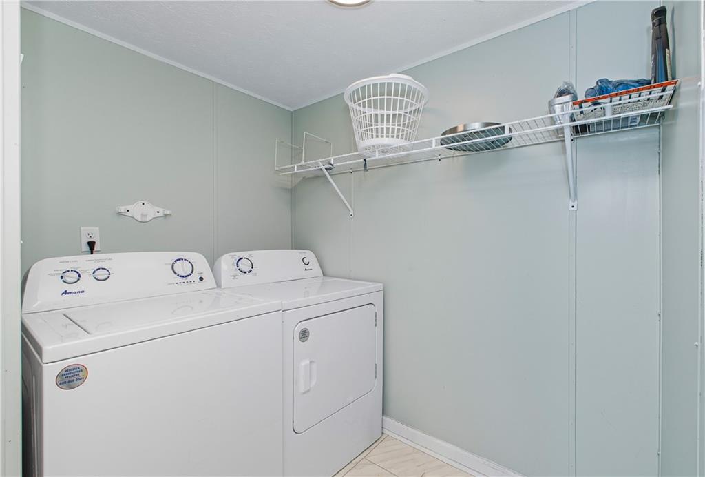 221 McAllister Road Cornelia, GA 30531 - Photo 21 of 58 a view of storage and utility room with racks on the wall