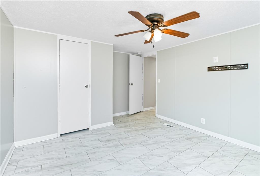 221 McAllister Road Cornelia, GA 30531 - Photo 24 of 58 an empty room with ceiling fan and a ceiling fan