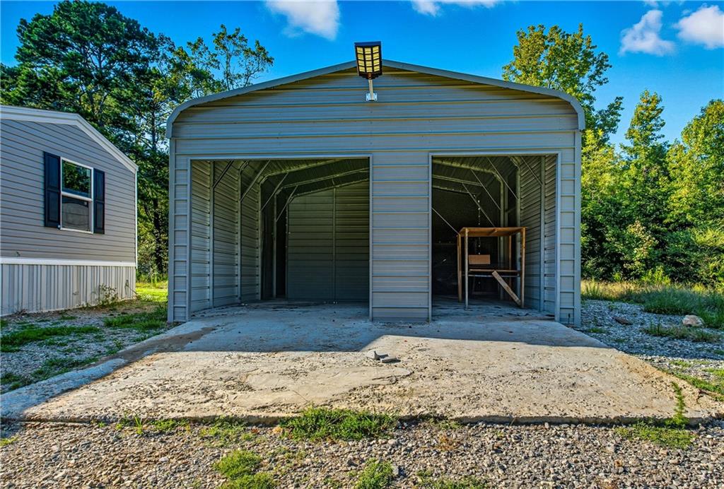 221 McAllister Road Cornelia, GA 30531 - Photo 25 of 58 a front view of a house with a yard