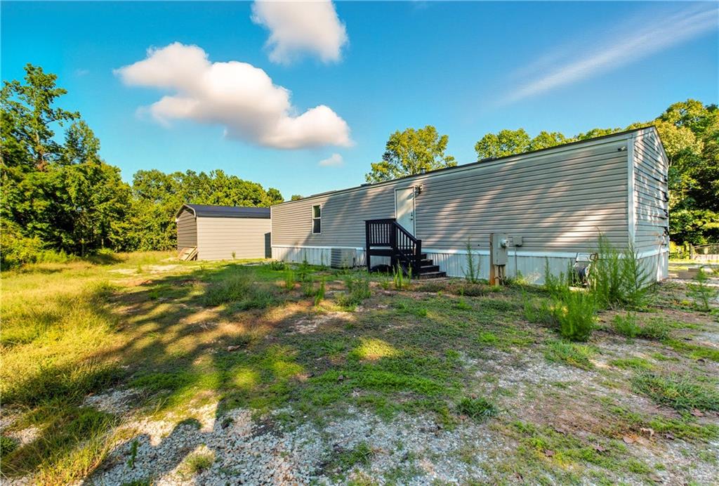 221 McAllister Road Cornelia, GA 30531 - Photo 29 of 58 a house view with a garden space