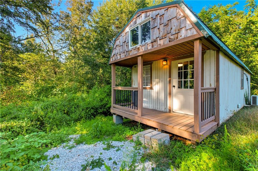 221 McAllister Road Cornelia, GA 30531 - Photo 33 of 58 a view of a house with backyard and sitting area