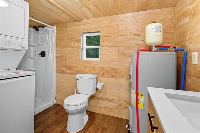 a view of a hallway with furniture and a kitchen