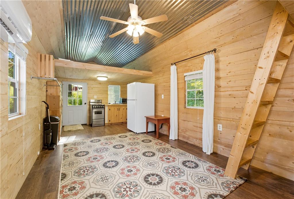 221 McAllister Road Cornelia, GA 30531 - Photo 42 of 58 a view of a hallway with furniture and a kitchen