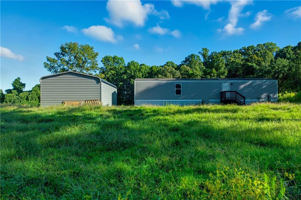 221 McAllister Road Cornelia, GA 30531 - Photo 48 of 58 a view of a house with a yard