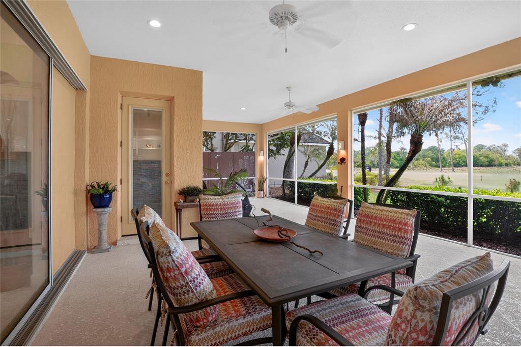2968 Plantation Road Winter Haven, FL 33884 - Photo 48 of 81 a view of a dining room with furniture large windows and wooden floor