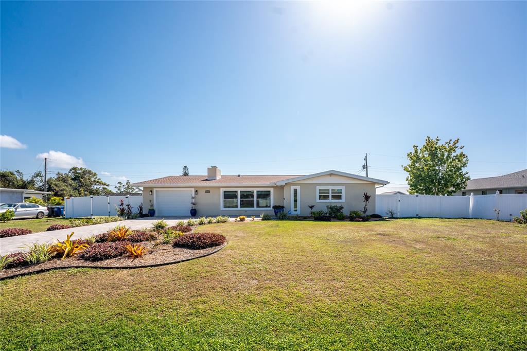 1313 Buereau Road Englewood, FL 34223 - Photo 1 of 1 a view of a house with yard and sitting area