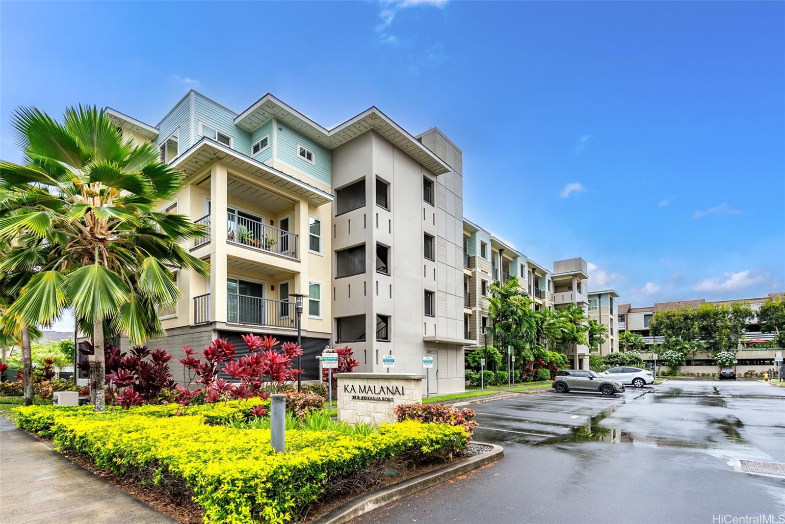 a view of a building with a yard and sitting area